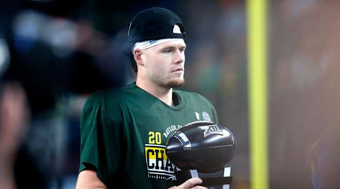 Baylor quarterback Blake Shapen holds the Most Outstanding Player trophy after winning the Big 12 championship game on Dec. 4 in Arlington, Texas.